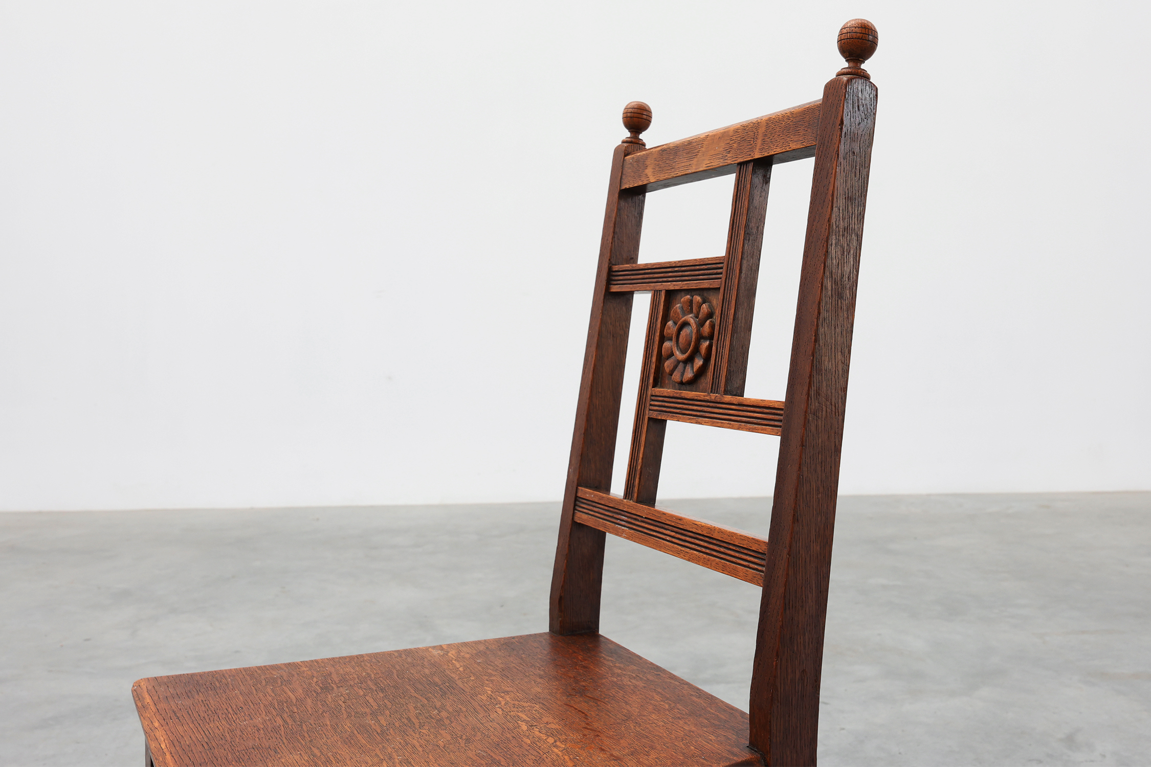 Art Deco oak side chair with carved rosette back and turned front legs, Belgium ca. 1915thumbnail